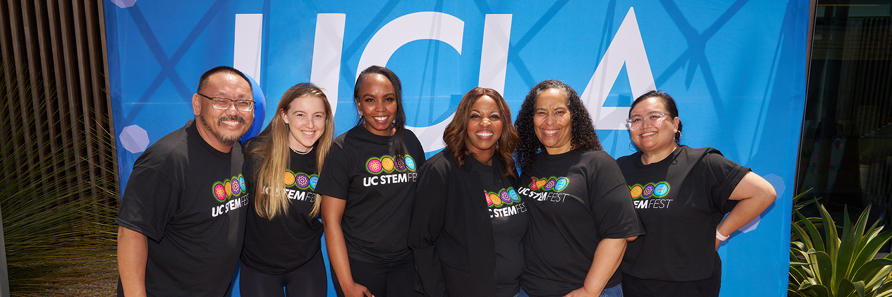 UCLA Staff in front of blue background
